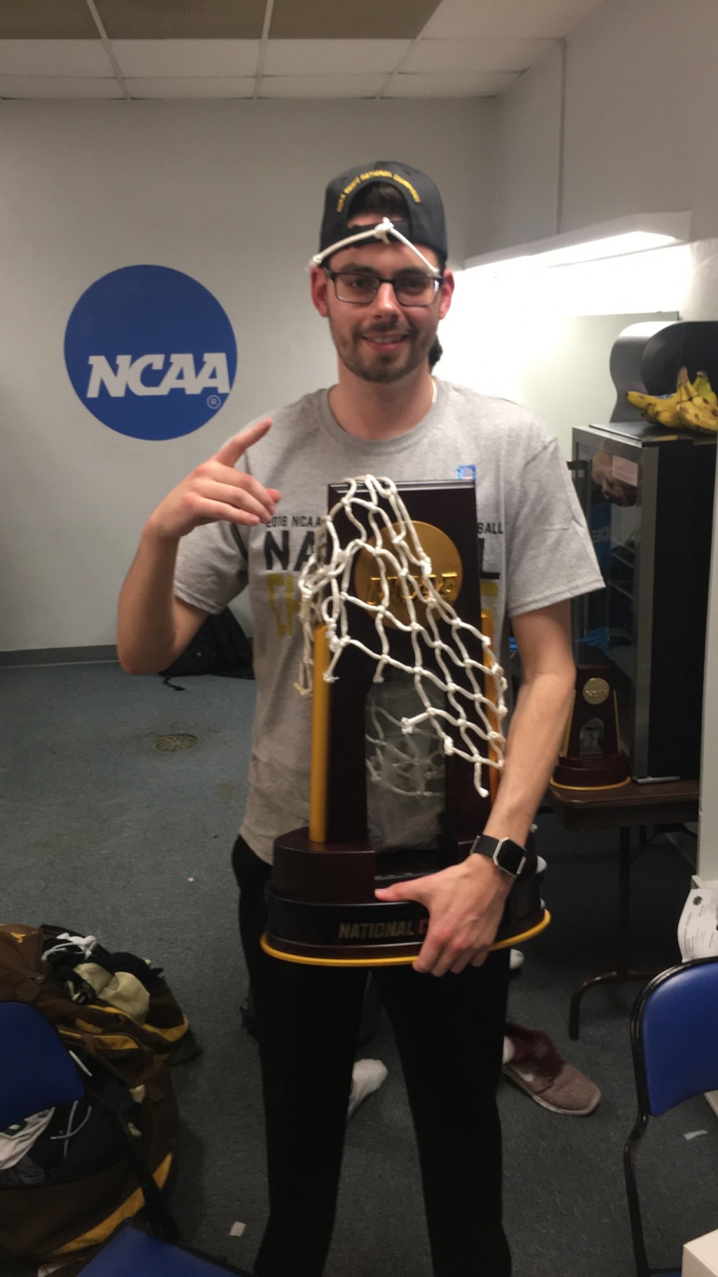 Grad wins division III hoops championship in first year as assistant coach